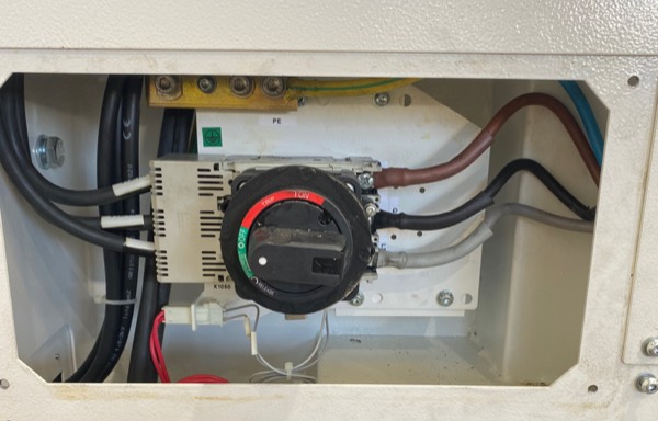 Three-phase rotary isolator installed in a commercial enclosure